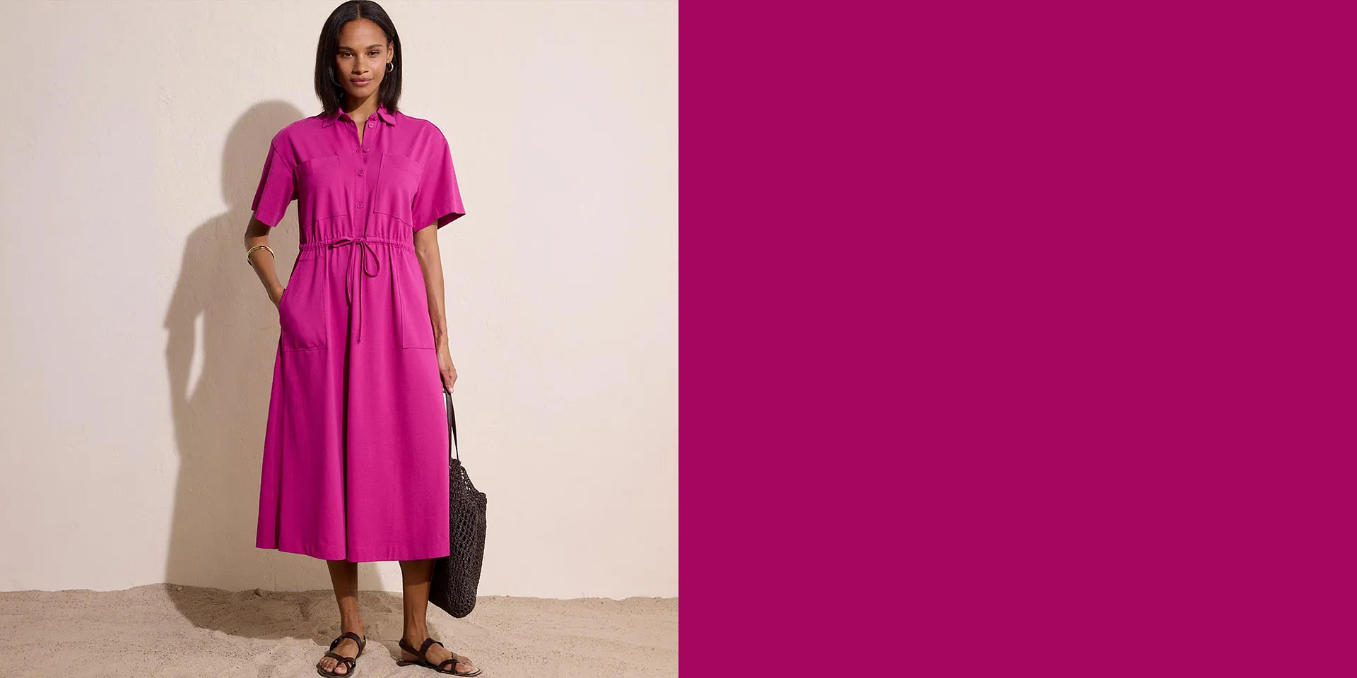 Elegante abito midi fucsia con maniche corte e cintura.