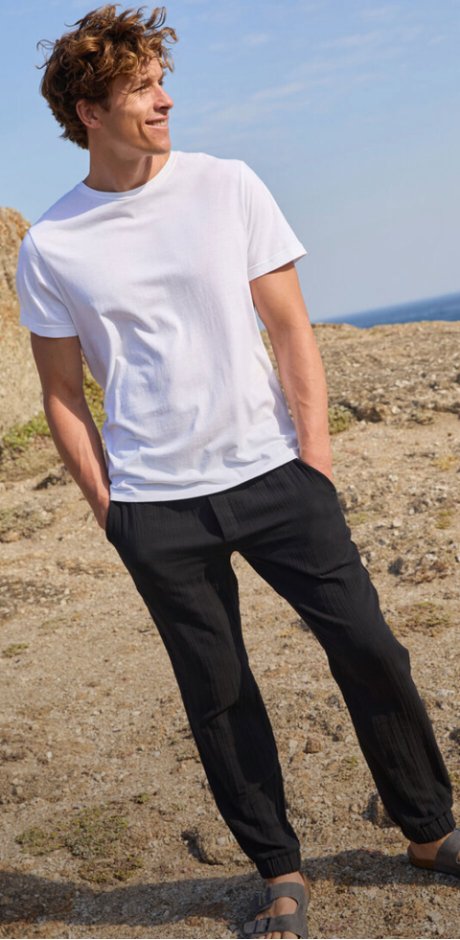Uomo - Pantaloni in mussola con elastico in vita regular fit, tapered - Nero