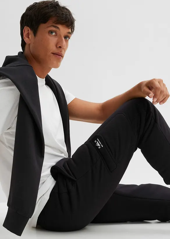 Pantaloni da jogging termici con tasche cargo e fodera effetto peluche, bonprix