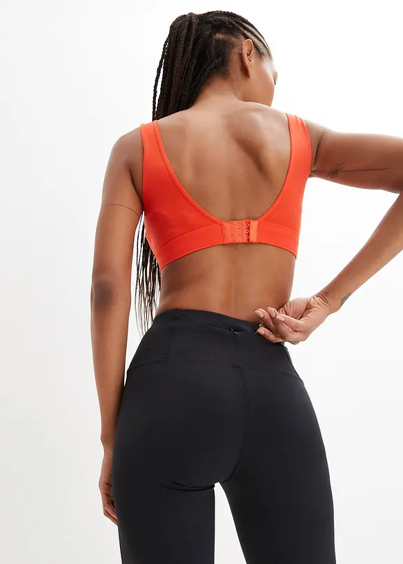 Pantaloni sportivi modellanti con tasca, svasati, bonprix
