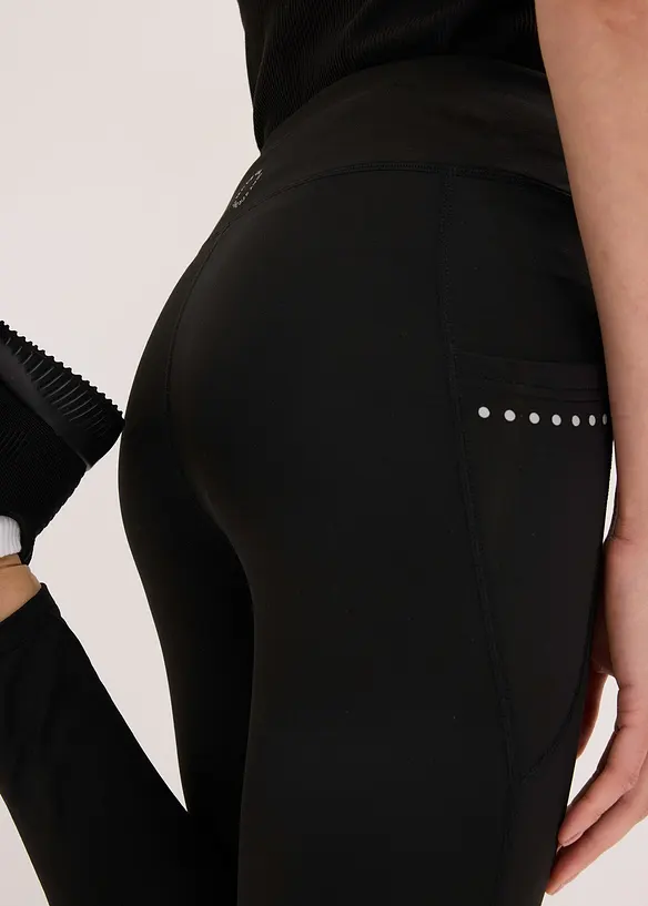 Leggings termici con dettagli riflettenti e tasca per il cellulare, bonprix