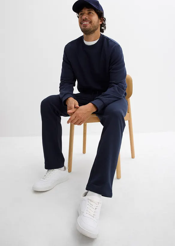 Pantaloni da jogging con pratiche tasche zippate, bonprix
