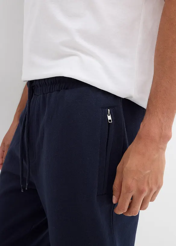 Pantaloni da jogging con pratiche tasche zippate, bonprix