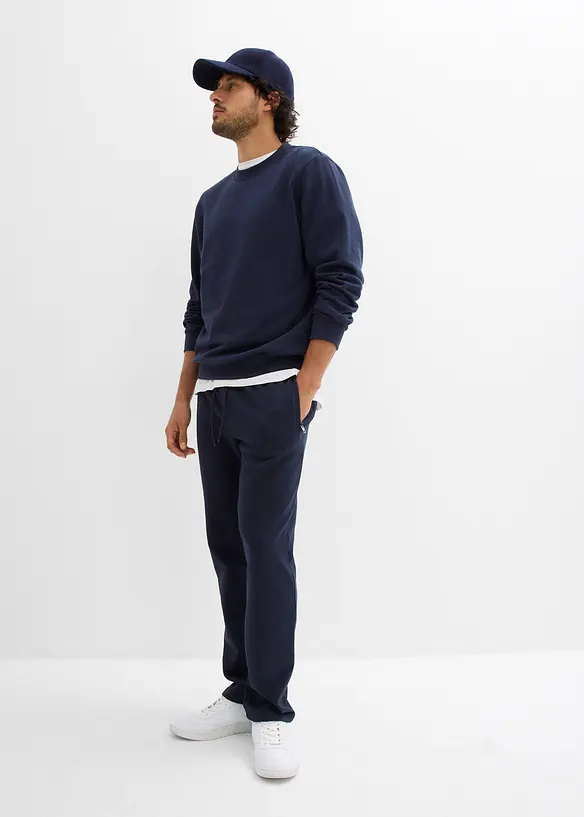 Pantaloni da jogging con pratiche tasche zippate, bonprix