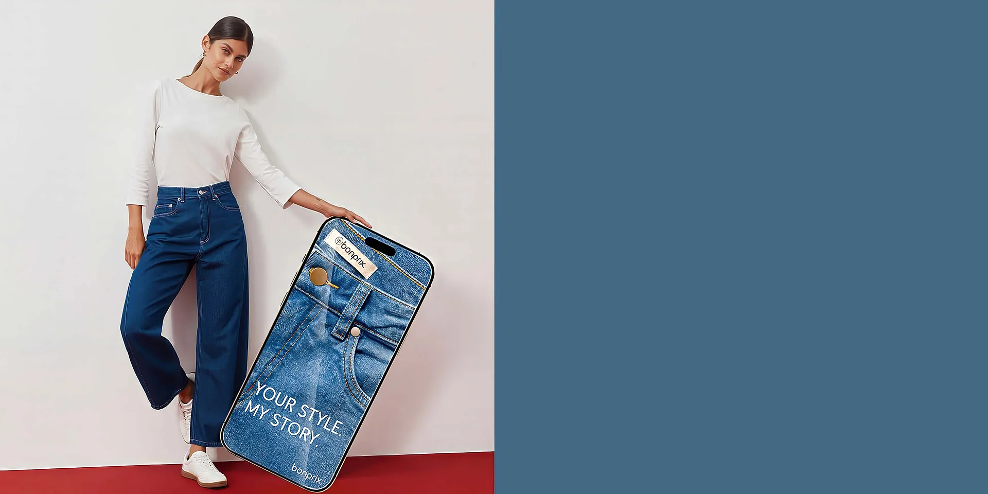 Top bianco, jeans larghi alla moda e scarpe da ginnastica.