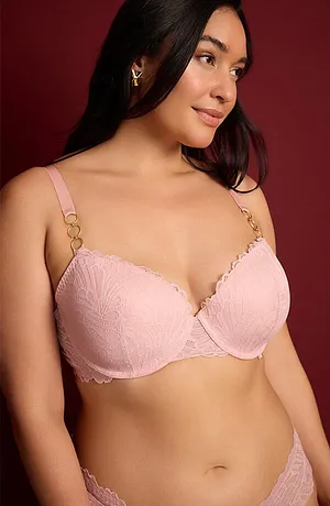 Reggiseno rosa pallido con pizzo e spalline sottili.