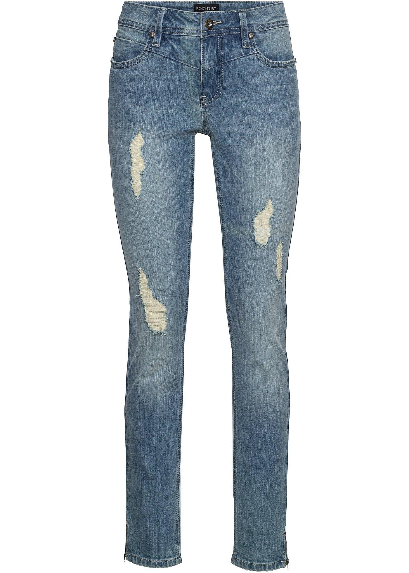 Jeans moderni elasticizzati cropped con cerniere al fondo. Blu denim