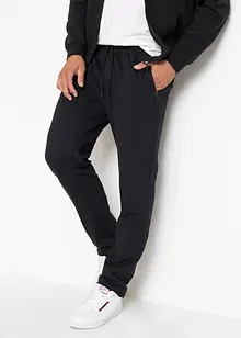 Pantaloni da jogging con pratiche tasche zippate, bonprix