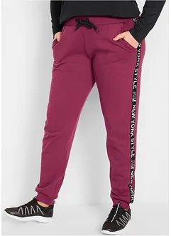 Pantaloni in felpa con fascette e scritta statement, bonprix