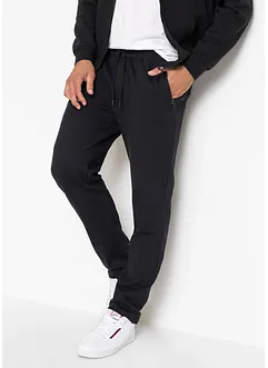 Pantaloni da jogging con pratiche tasche zippate, bonprix