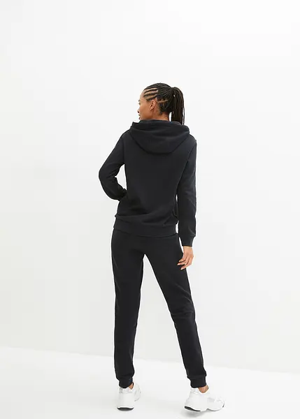 Completo tuta alla moda composto da due pezzi, felpa corta e pantaloni a gamba larga - Italia