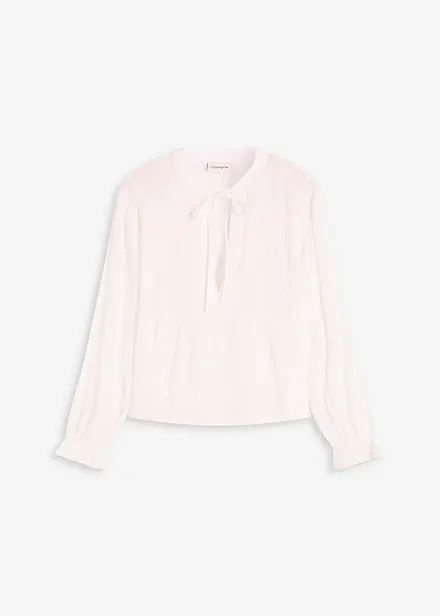 Blusa con ricami traforati