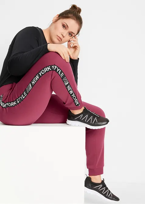 Pantaloni in felpa con elastico in vita e stampa con scritta, bonprix