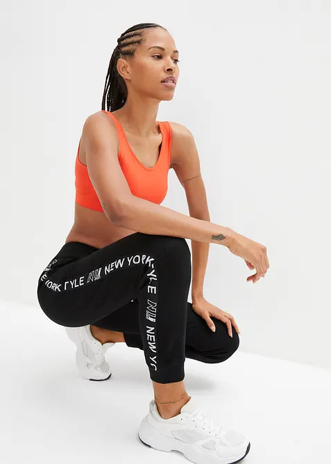 Pantaloni in felpa con elastico in vita e stampa con scritta, bonprix