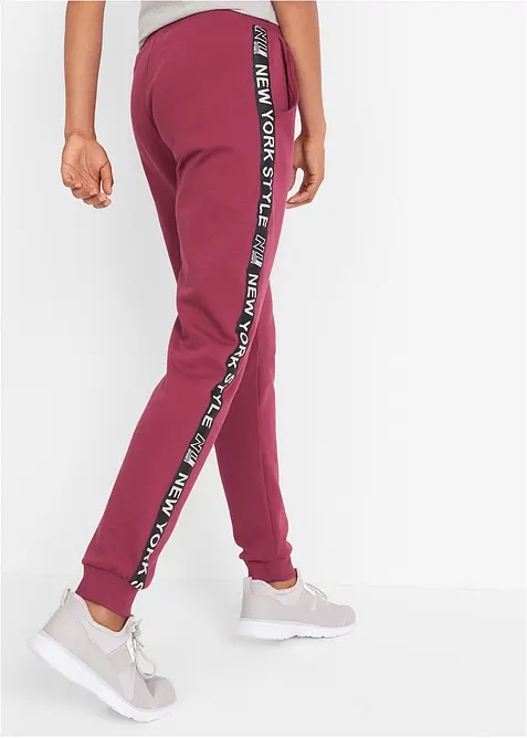 Pantaloni in felpa con elastico in vita e stampa con scritta, bonprix