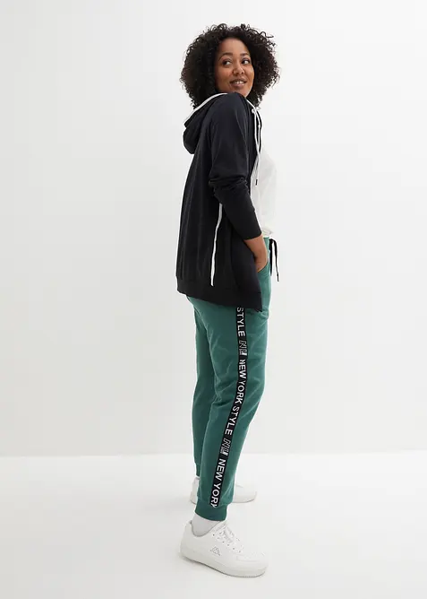 Pantaloni in felpa con elastico in vita e stampa con scritta, bonprix