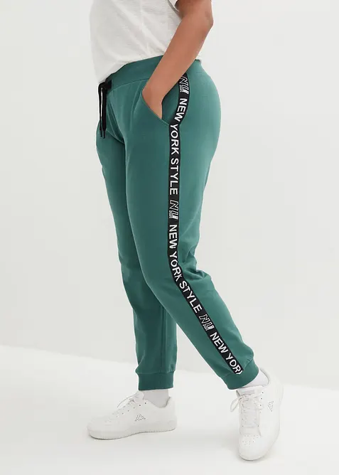Pantaloni in felpa con elastico in vita e stampa con scritta, bonprix
