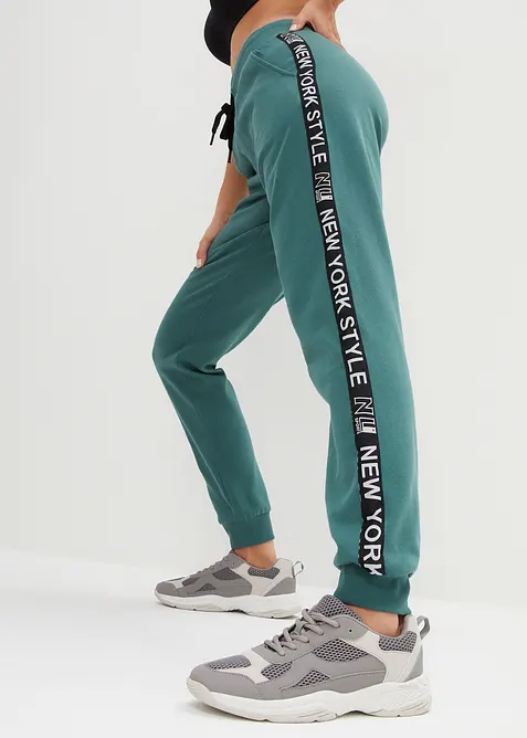 Pantaloni in felpa con elastico in vita e stampa con scritta, bonprix