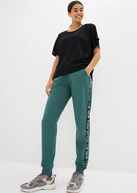 Pantaloni in felpa con elastico in vita e stampa con scritta, bonprix