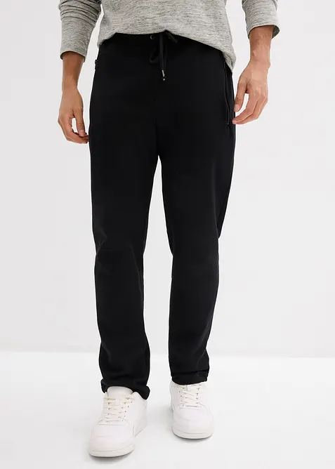 Pantaloni da jogging in cotone biologico con pratiche tasche zippate, bonprix