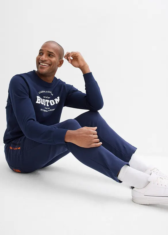 Pantaloni da jogging in cotone biologico con pratiche tasche zippate, bonprix