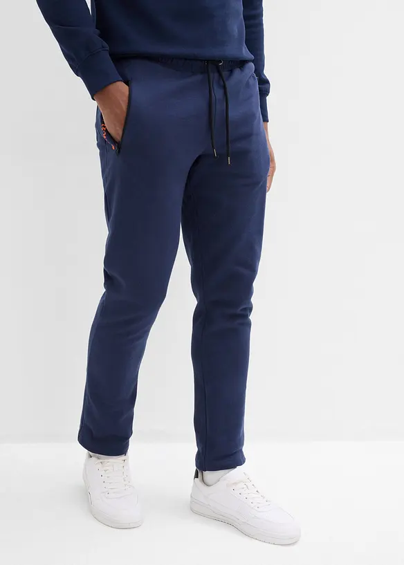 Pantaloni da jogging in cotone biologico con pratiche tasche zippate, bonprix
