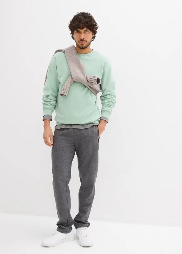 Pantaloni da jogging in cotone biologico con pratiche tasche zippate, bonprix