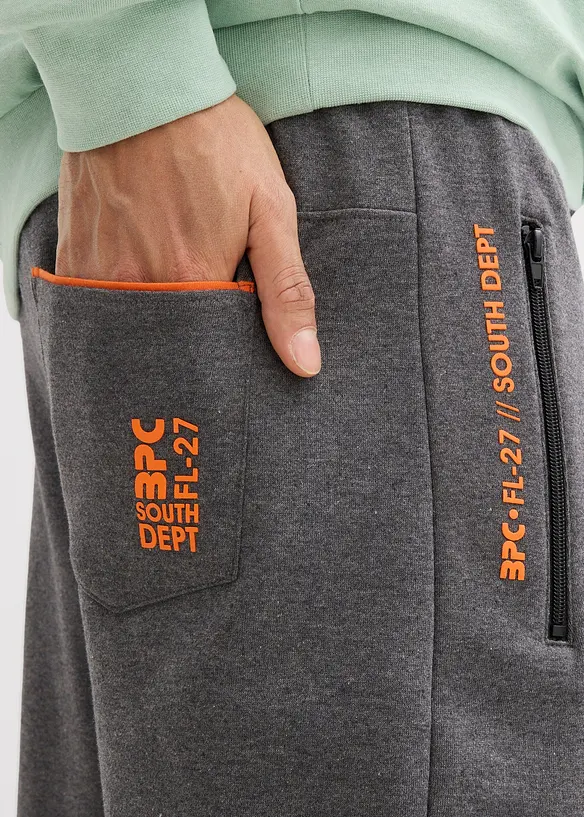 Pantaloni da jogging in cotone biologico con pratiche tasche zippate, bonprix