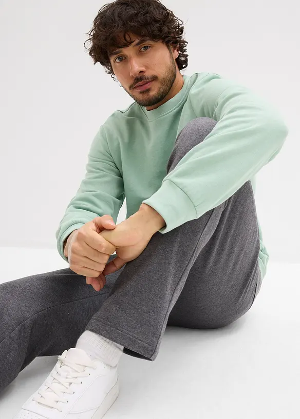 Pantaloni da jogging in cotone biologico con pratiche tasche zippate, bonprix