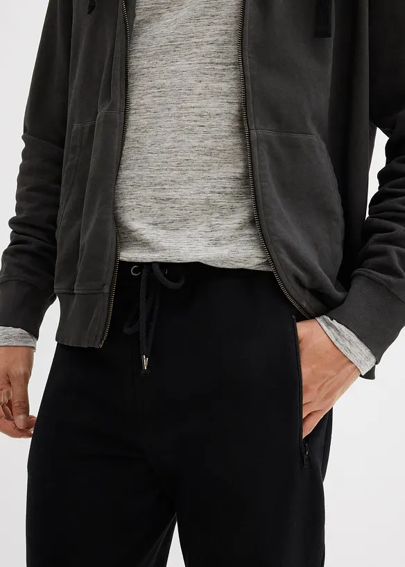 Pantaloni da jogging in cotone biologico con pratiche tasche zippate, bonprix