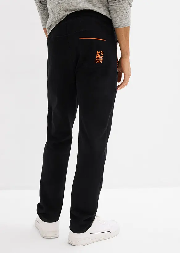 Pantaloni da jogging in cotone biologico con pratiche tasche zippate, bonprix