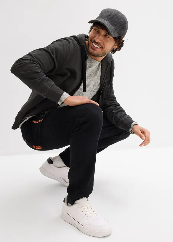 Pantaloni da jogging in cotone biologico con pratiche tasche zippate, bonprix