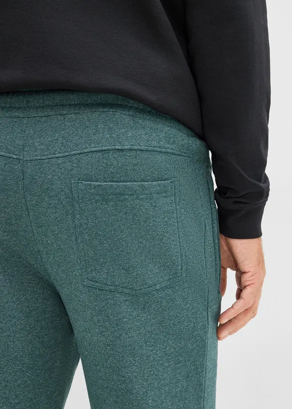 Pantaloni da jogging con tasche zippate, bonprix