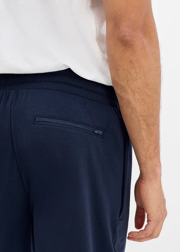 Pantaloni da jogging termici con tasche zippate, bonprix