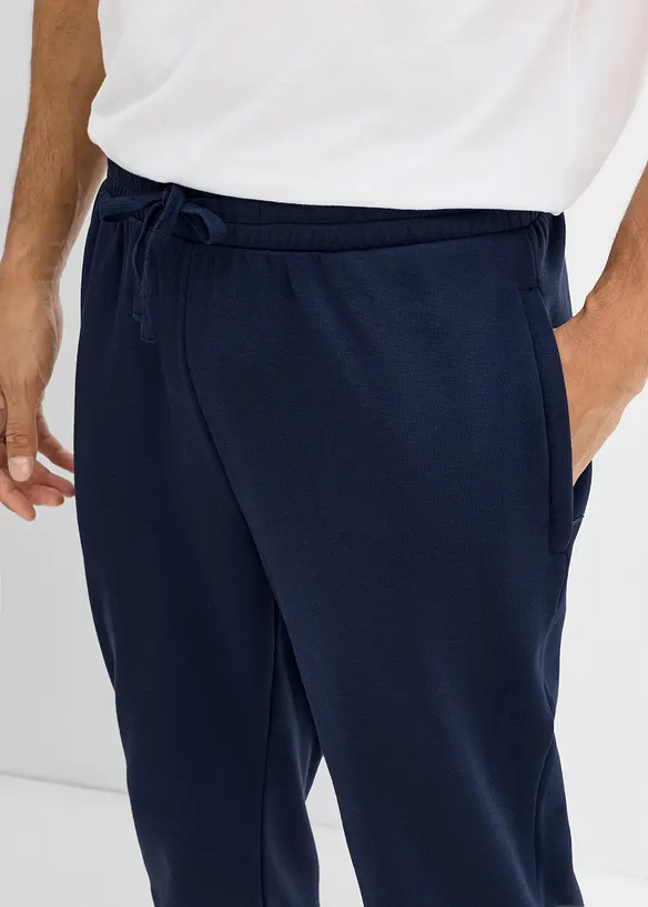 Pantaloni da jogging termici con tasche zippate, bonprix