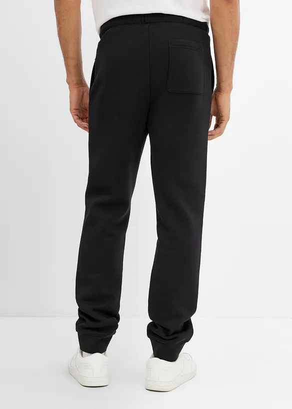 Pantaloni da jogging pesanti con dettagli in PU, bonprix
