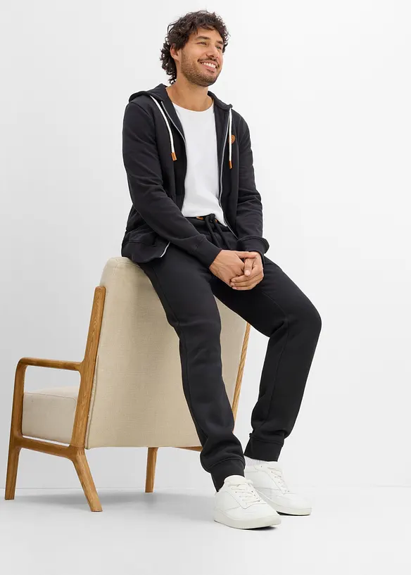 Pantaloni da jogging pesanti con dettagli in PU, bonprix
