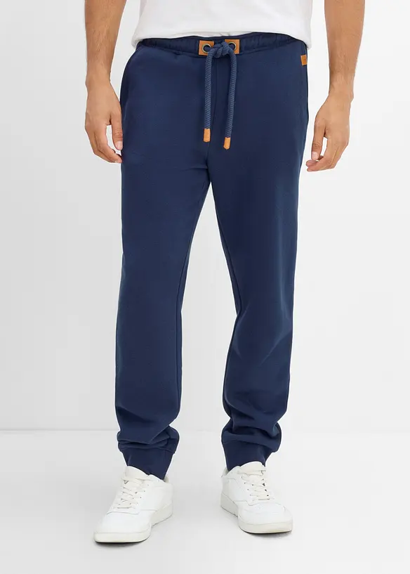 Pantaloni da jogging pesanti con dettagli in PU, bonprix