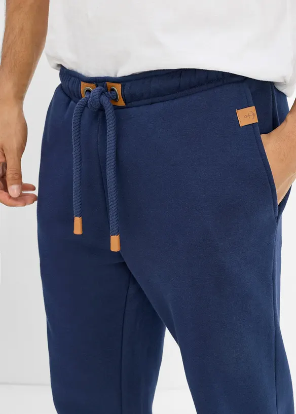 Pantaloni da jogging pesanti con dettagli in PU, bonprix