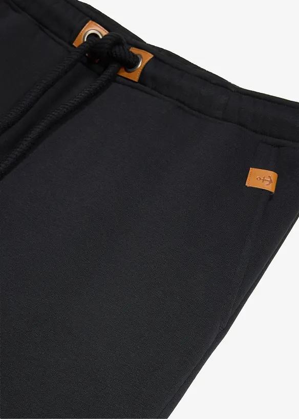 Pantaloni da jogging pesanti con dettagli in PU, bonprix