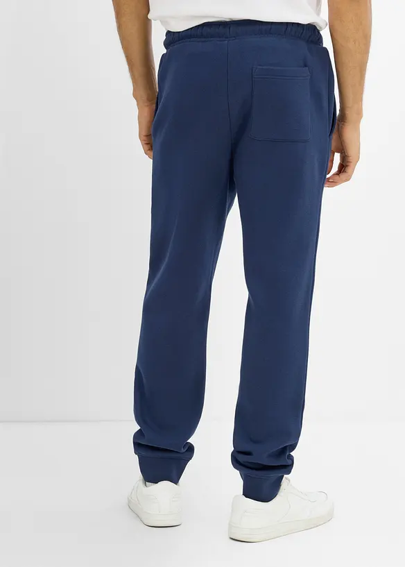 Pantaloni da jogging pesanti con dettagli in PU, bonprix