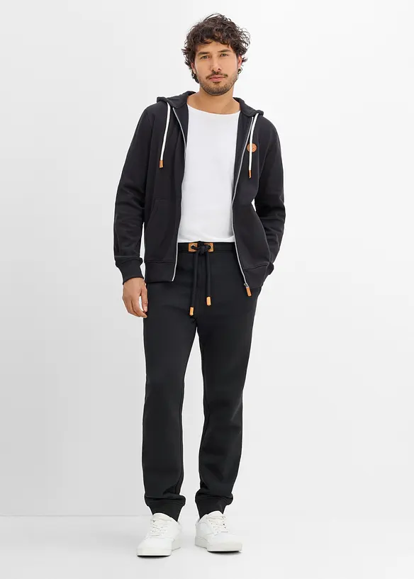 Pantaloni da jogging pesanti con dettagli in PU, bonprix